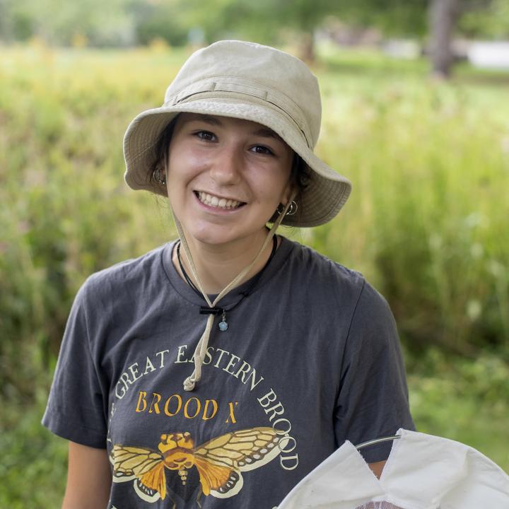 Karina Bellavia in the field with an insect net