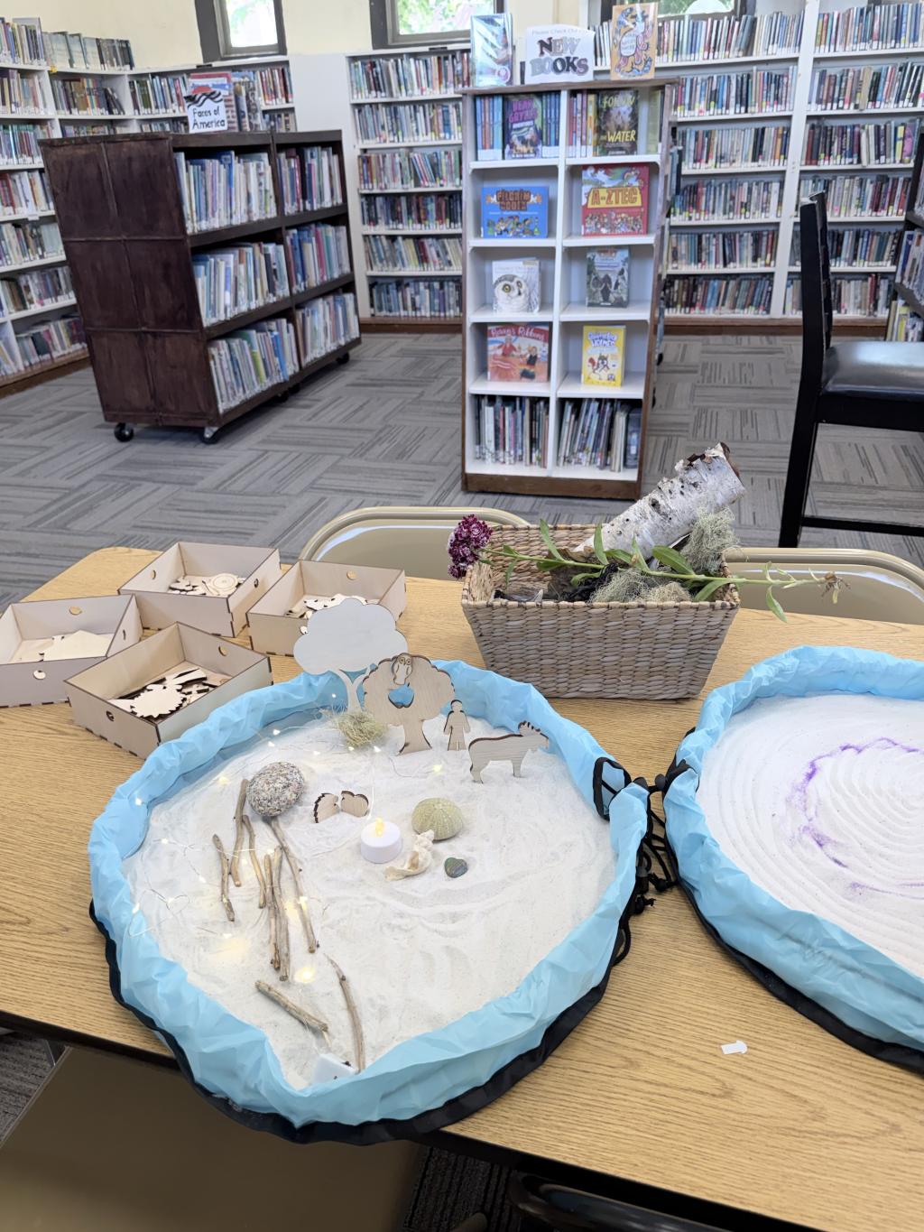 Sand art activity in a library setting.