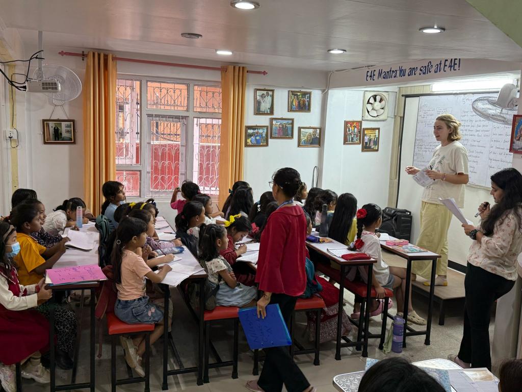 Group of girls listening to speaker