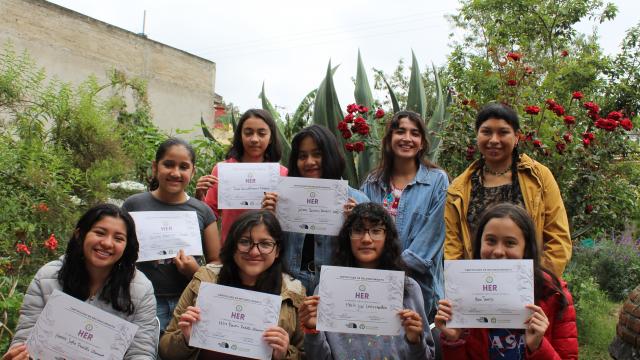 HER participants showing their certificates