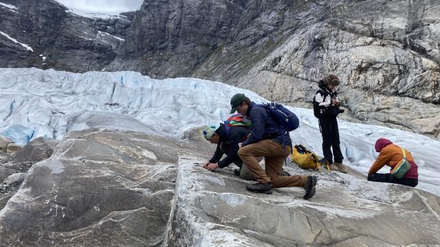 Glacier fieldwork with team of students. 