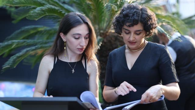 In this picture, I am with one of my supervisors during a company event focused on upcoming projects and reviewing past results. At that moment, we were in the middle of organizing the process