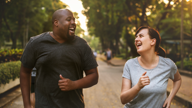 Two runners smiling