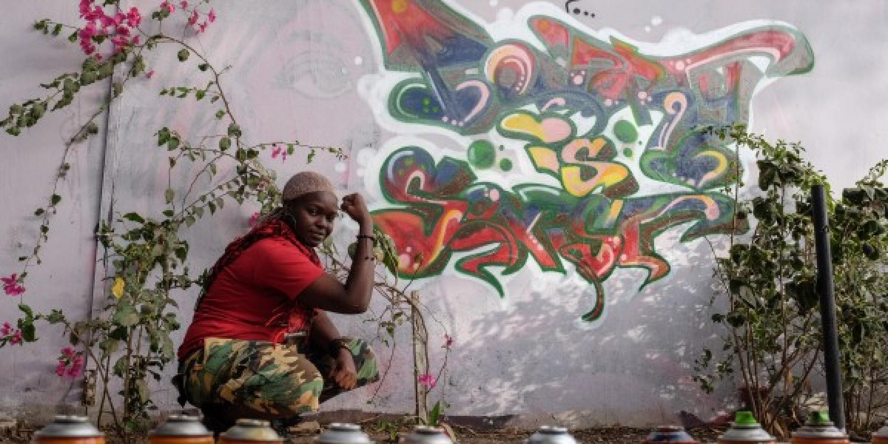 Dieynaba Sidibe and her artwork &amp;quot;Poverty is Sexist.&amp;quot;