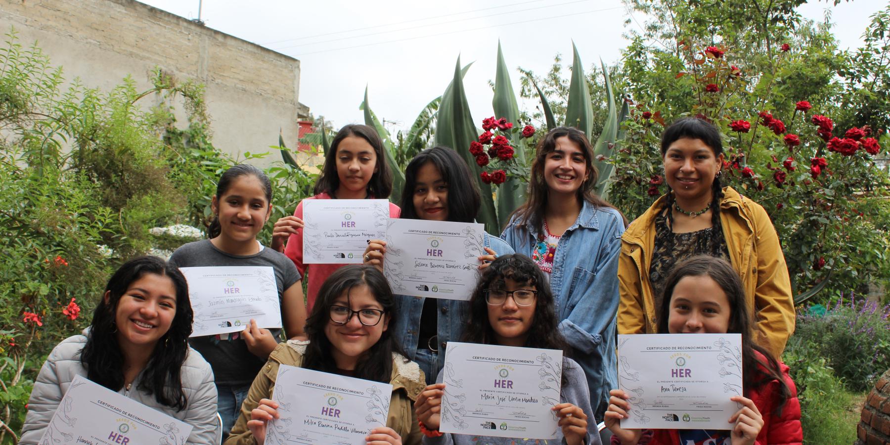 HER participants showing their certificates