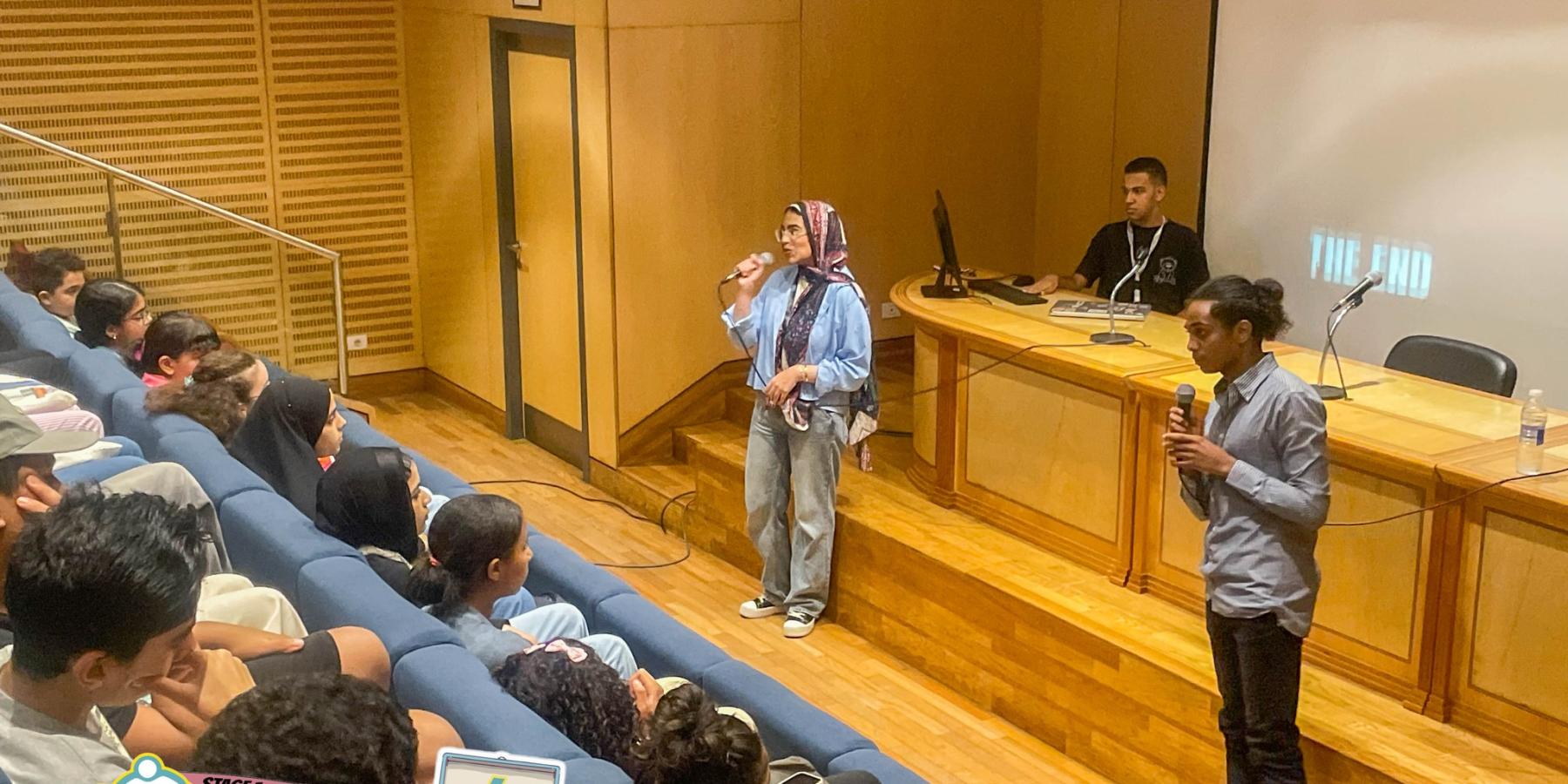 A picture shows Mahmoud giving a presentation for the internship