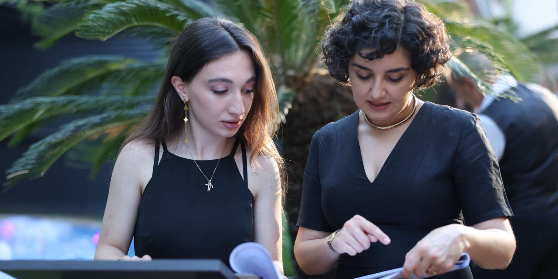 In this picture, I am with one of my supervisors during a company event focused on upcoming projects and reviewing past results. At that moment, we were in the middle of organizing the process