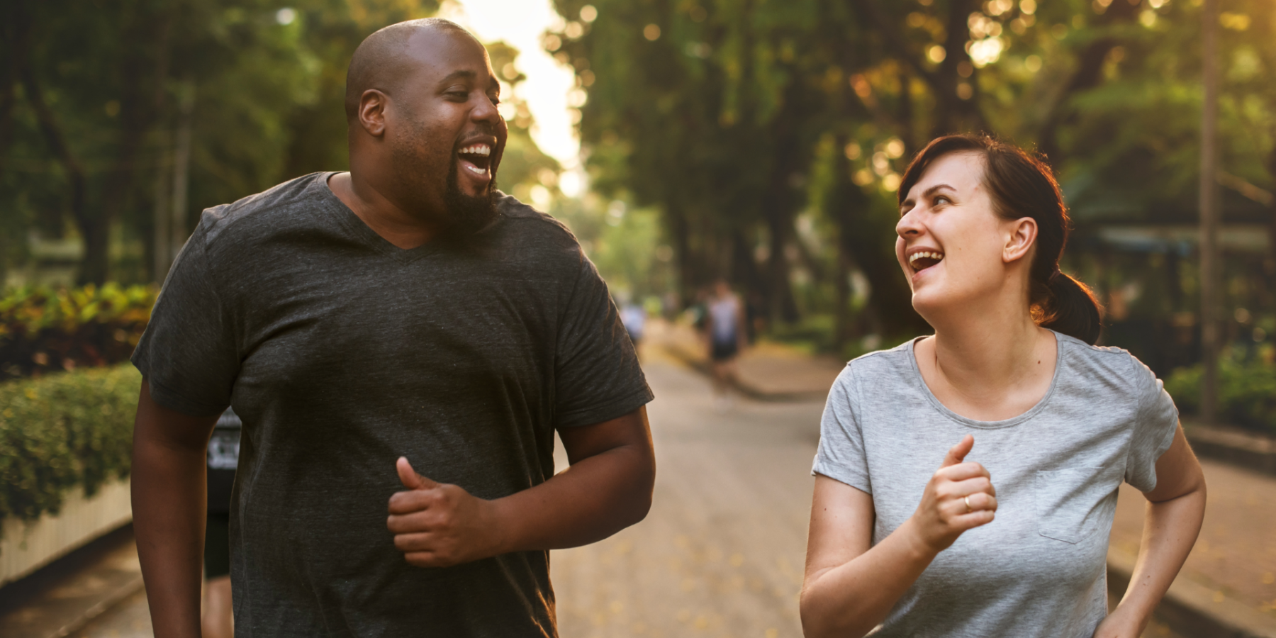 Two runners smiling