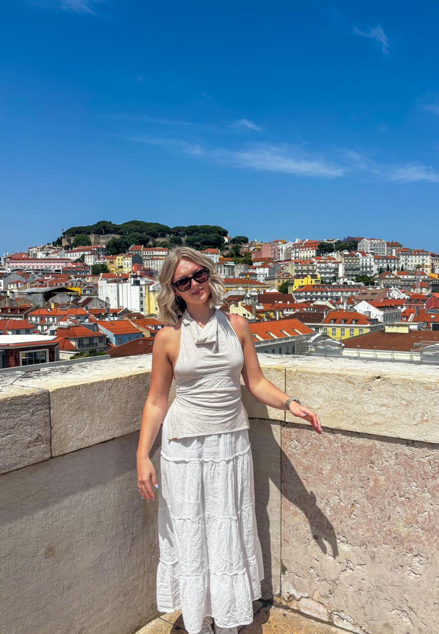 Lauren Bier atop a historic building in Lisbon, Portugal. During her free time throughout her internship, she frequently immersed herself in Portuguese culture and was passionate about learning more about Lisbon&#039;s rich history.