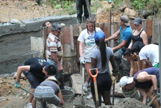 Alessandro helping to construct a bridge of cement for Los Campesinos, Costa Rica on the 19th of February 2020.