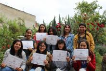 HER participants showing their certificates