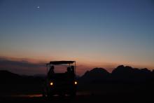Photo of the sunset in the desert at Wadi Rum Preserve