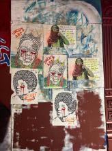 A collage of portraits glued to a wall, splattered with paint that resembles red teardrops from coming from the portraits&#039;  eyes.