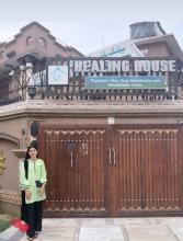 The researcher standing outside the hospital- The Healing House