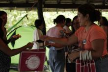 Fernanda handing out Mano Vuelta&#039;s merch to participants of the 6th Camp for the Right to choose