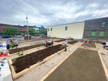 Noah Donnellan-Doser is the midst of a story on the Canton demonstration garden.