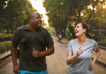 Two runners smiling