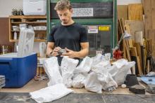 Image of Geo with geologic sampling bags.