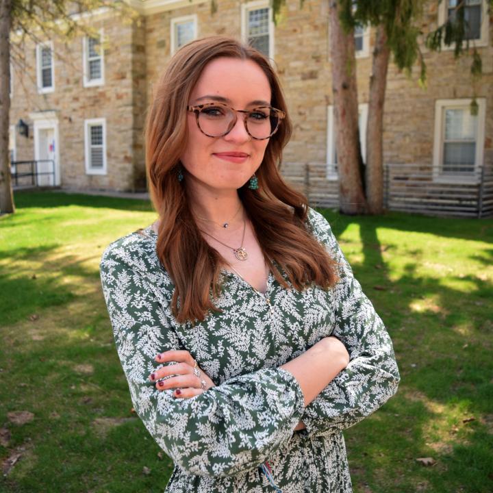 Profile photo centered in front of Sykes Residence Hall.