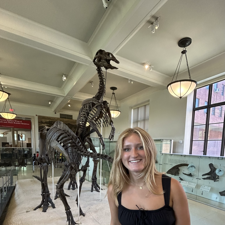 image of lindsay infront of dinosaur