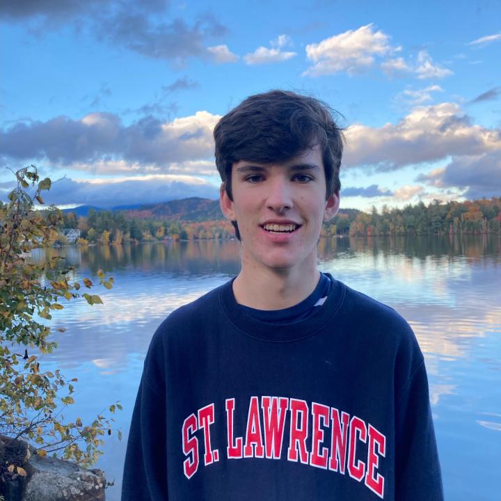 Elijah White near a beautiful body of water