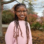 Picture of woman in pink sweater and glasses
