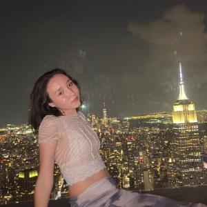 Photo of me sitting on the floor in one of the skyscrapers in NYC. 