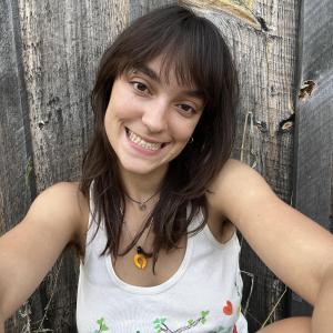 Photo of Kate taken at a Birdsfoot Farm&#039;s off-grid farmer&#039;s cabin