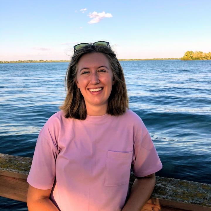 Photo of Kayla in front of a river