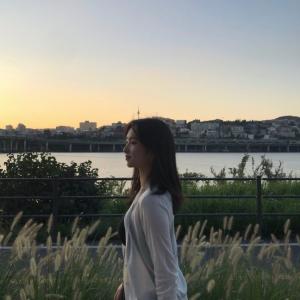 A photograph of Margeunsol Yang taken during a sunset.